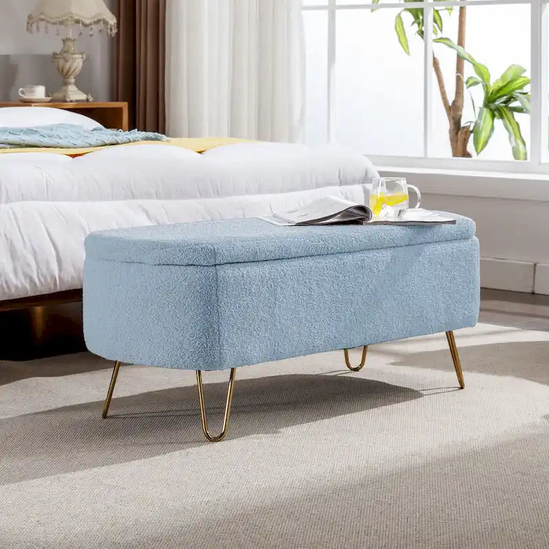 Banc pouf de rangement bleu avec pieds dorés